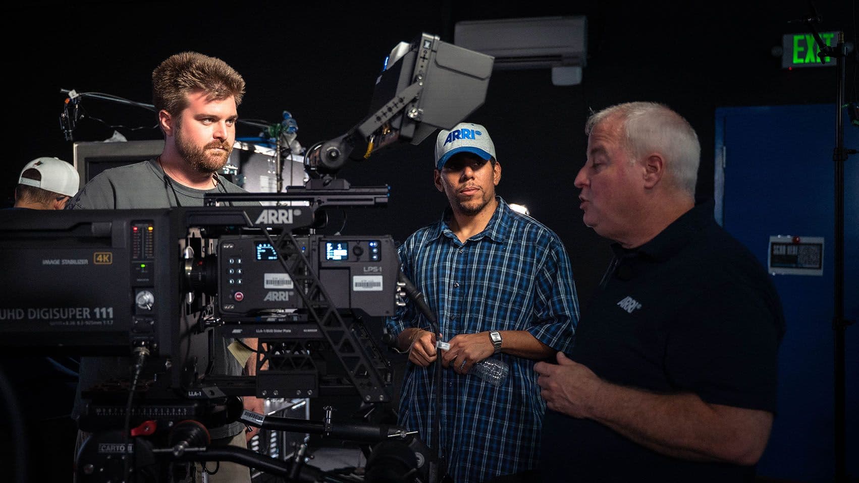 LMG crew members reviewing an ARRI ALEXA 35 Live configuration with an ARRI trainer during setup.