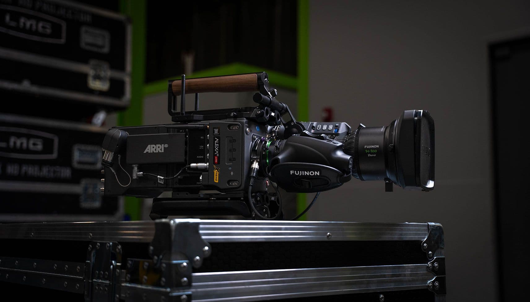 Profile view of an ARRI ALEXA 35 Live Xtreme camera body with a Fujinon 14-100 Duvo servo zoom lens.